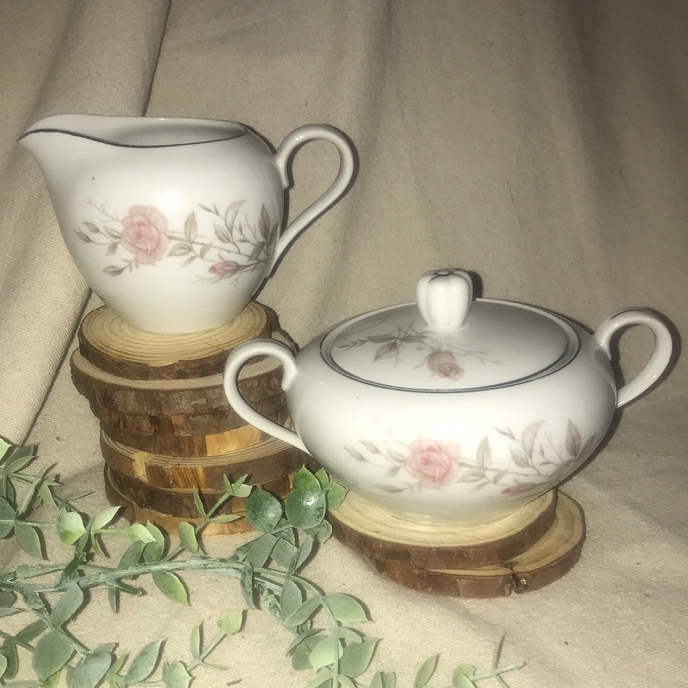 Fine China, Pattern name is Laura 8542. Sugar bowl with lid and a creamer.